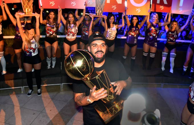 Drake carries the Larry O&#x27;Brien NBA Championship Trophy