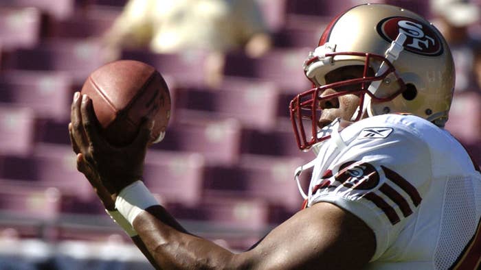 Kevin Ware grabs a warmup pass at Raymond James Stadium in Tampa, Florida November 21, 2004.