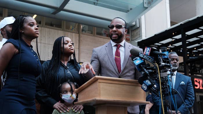 Lawyer B&#x27;Ivory Lamarr stands with community activists and members of the Brown family