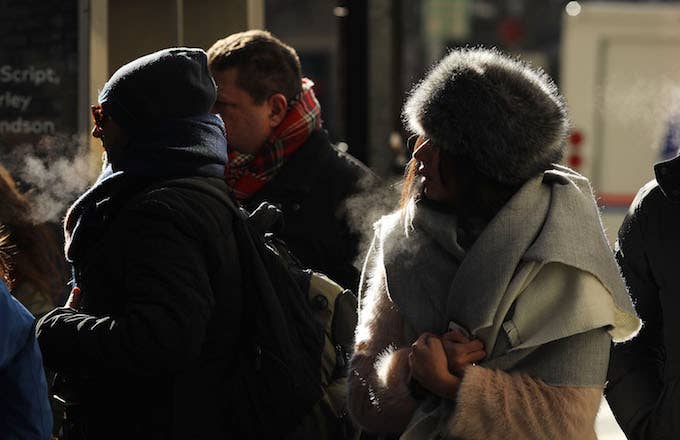 People walk through a frigid Manhattan