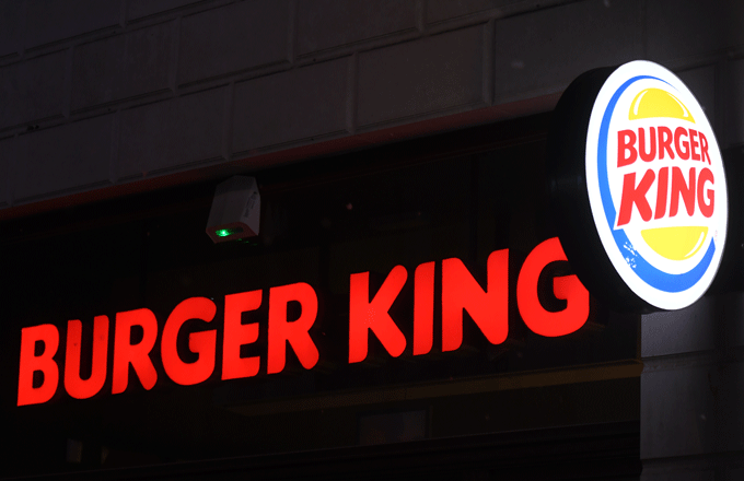 A Burger King sign shines bright in Krakow, Poland.