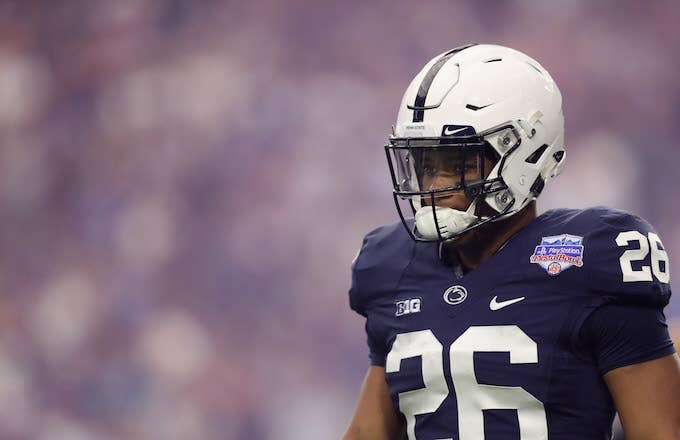 Saquon Barkley walks onto the field before Fiesta Bowl