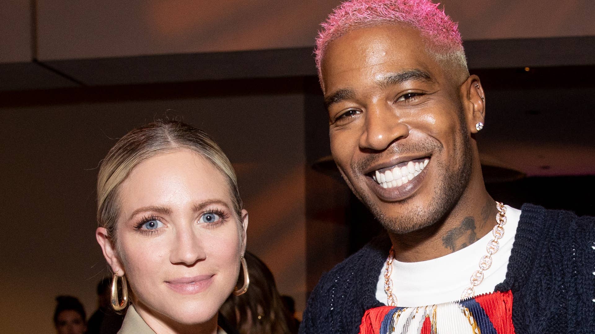 Brittany Snow and Kid Cudi take a photo together at a screening event.