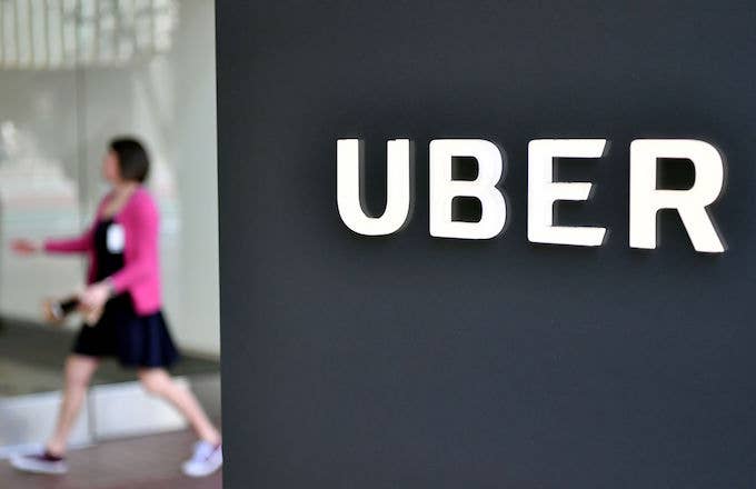 A woman walks into the Uber Corporate Headquarters building in San Francisco, California.