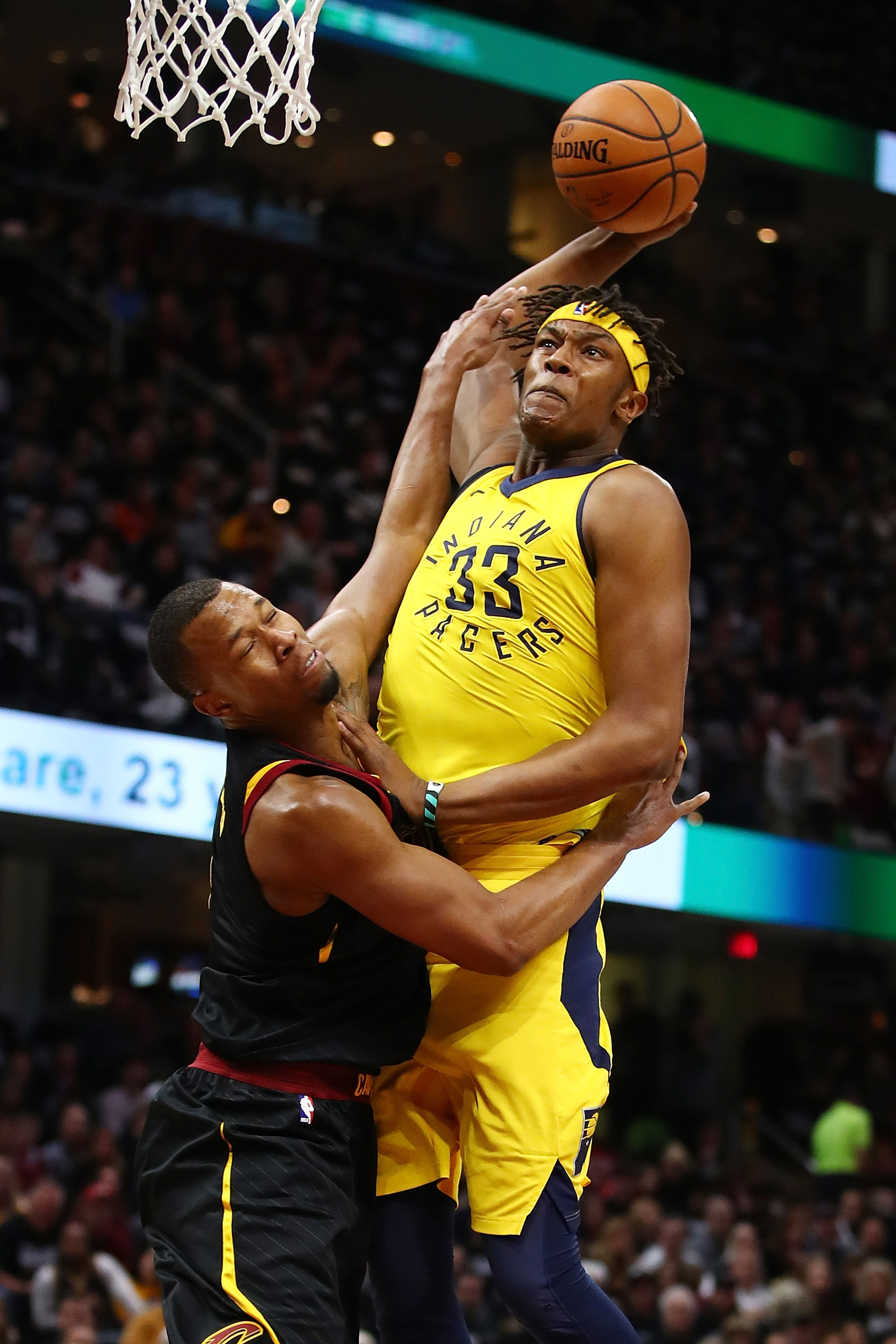 Myles Turner #33 of the Indiana Pacers dunks past Rodney Hood #1 of the Cleveland Cavaliers