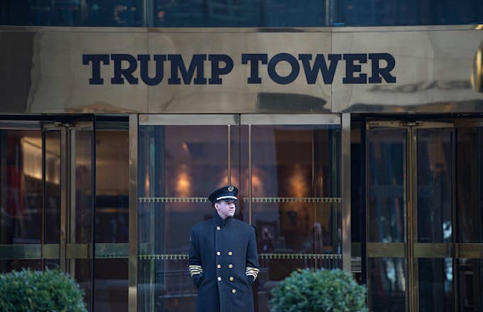 A doorman stands in front of Trump Tower during the Women&#x27;s March