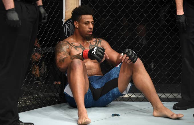 Greg Hardy sits in his corner after being disqualified