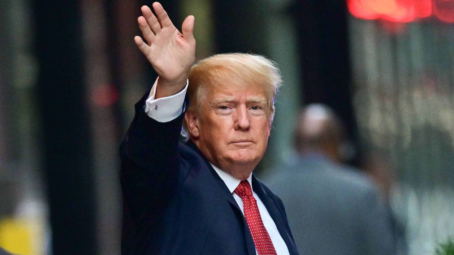 Donald Trump is pictured waving at the camera