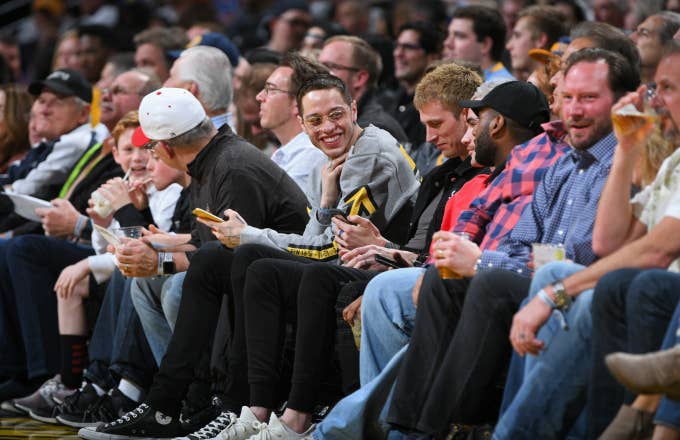 Pete Davidson, and Machine Gun Kelly is seen at the game