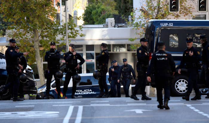 Spanish police stand guard near the United States Embassy in Madrid on Thursday