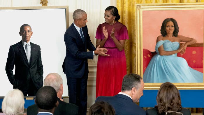 Former U.S. President Barack Obama and First Lady Michelle Obama participate in a ceremony