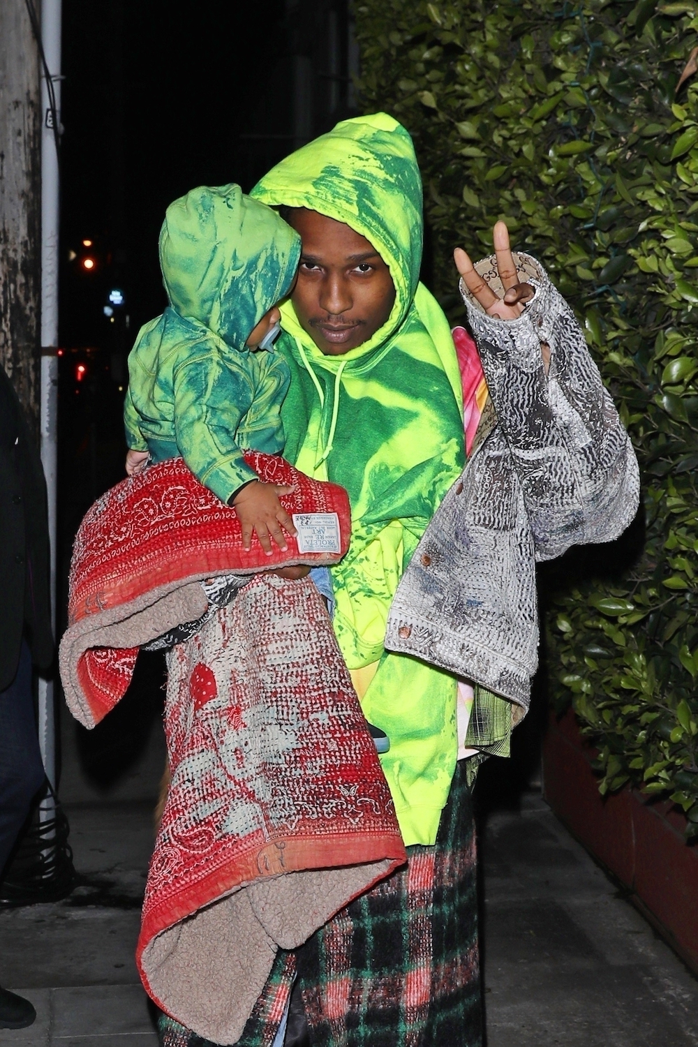 ASAP Rocky Wearing a matching hoodie with his baby son.