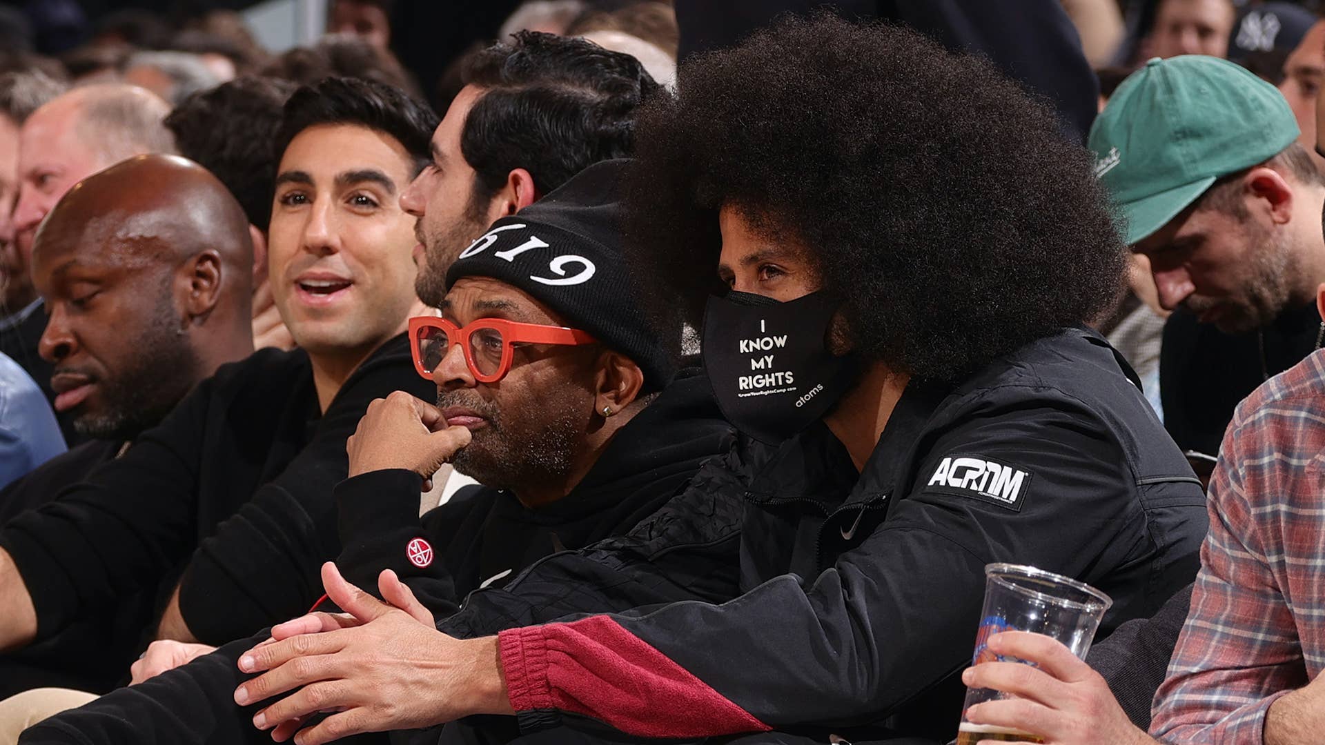 American film director, Spike Lee, and American activist, Colin Kaepernick, attend a game.