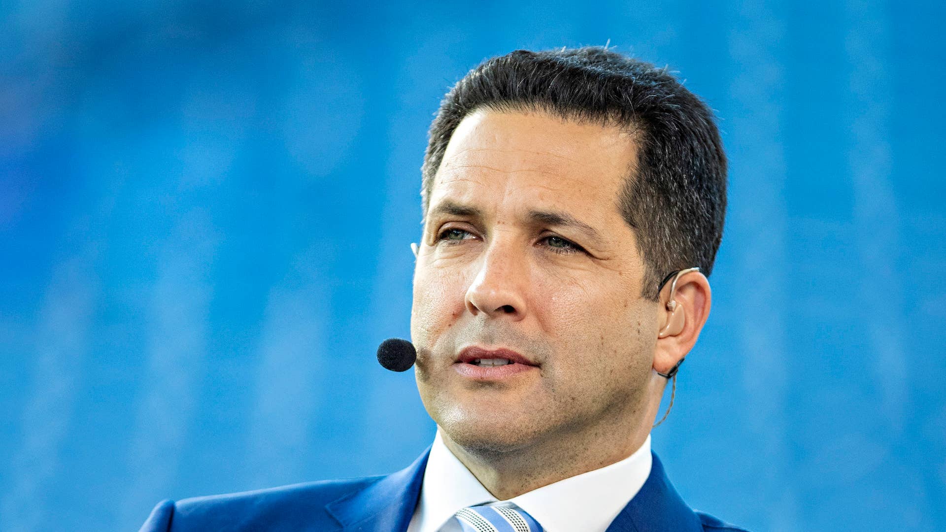 ESPN analyst Adam Schefter on tv broadcast before a game.