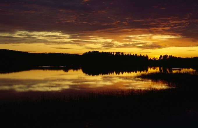 Sunset and clouds over a lake, Lakeland, Finland.