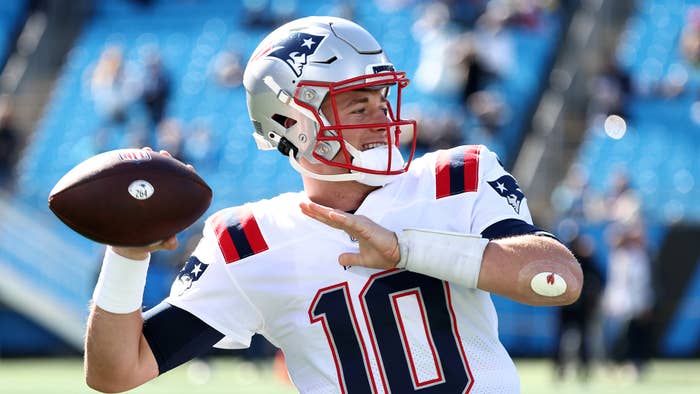 Mac Jones #10 of the New England Patriots throws the ball during pregame warm-ups before the game against the Carolina Panthers