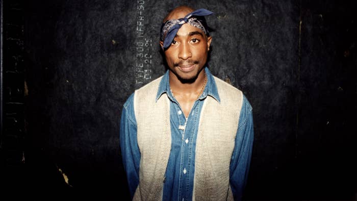 Tupac Shakur poses for photo backstage following performance.