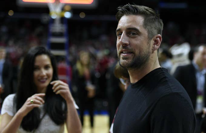 Aaron Rodgers and Olivia Munn at a basketball game.