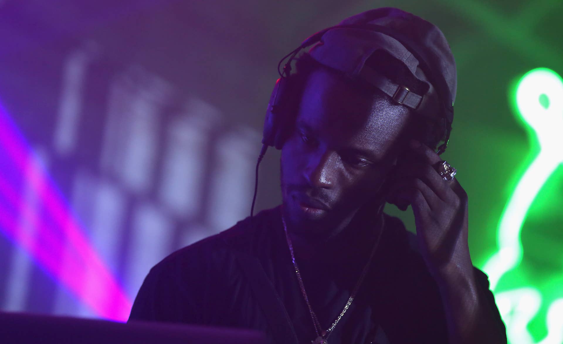 DJ Dahi performs onstage during an adidas event