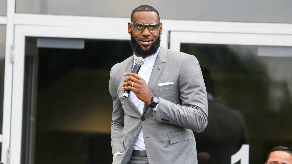 LeBron James addresses a crowd at the grand opening of the I Promise school