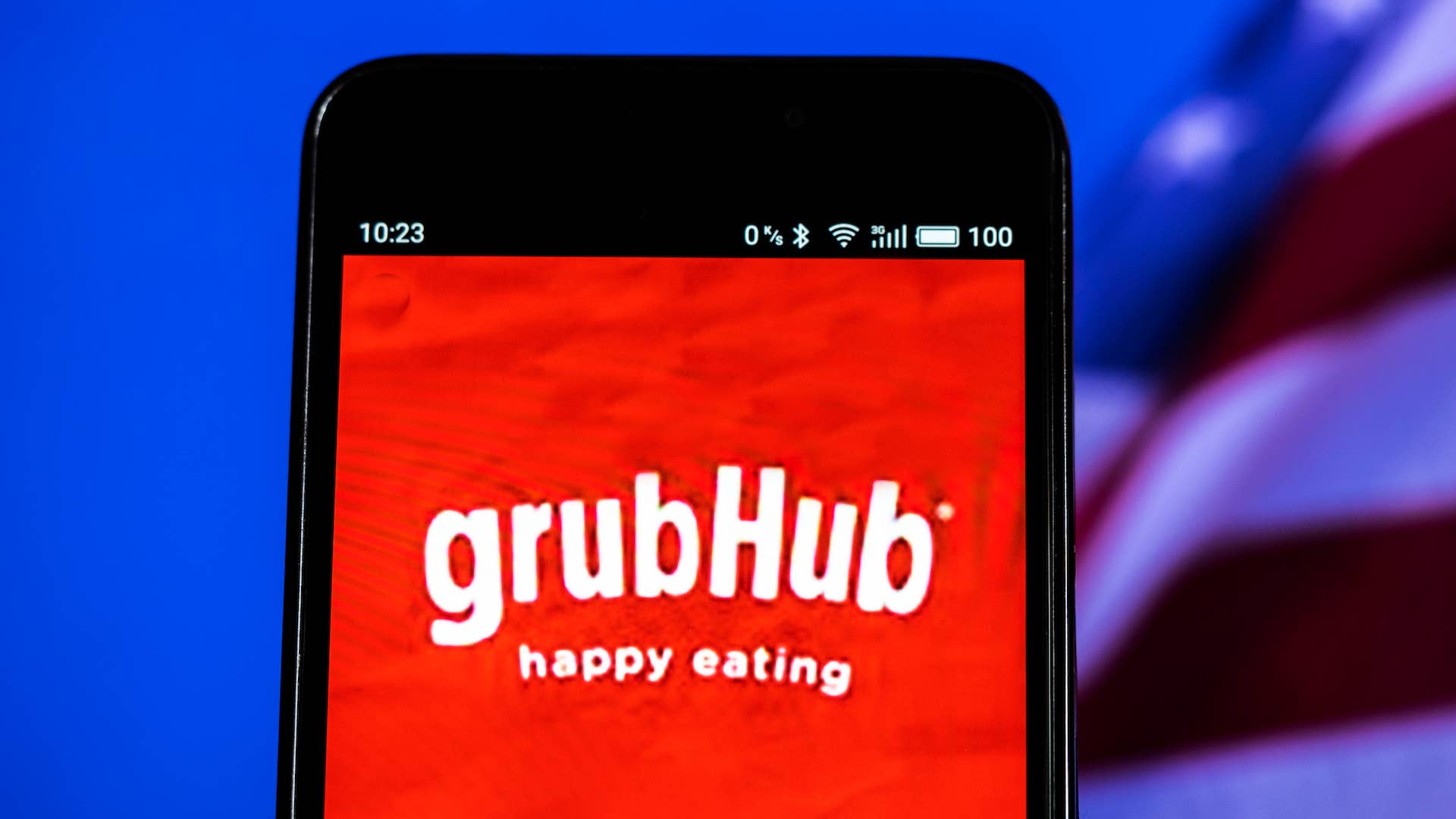 In this photo illustration, the GrubHub logo seen displayed on a smartphone.