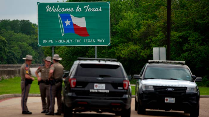 Texas troopers are pictured wearing comical hats