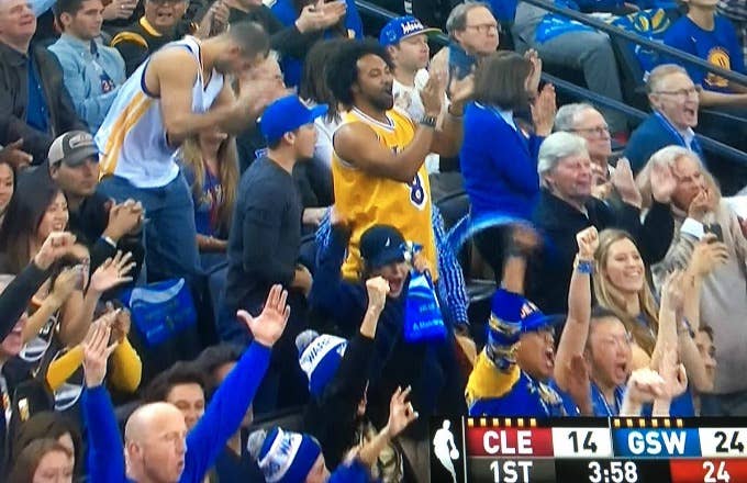 Warriors fan in a Kobe Bryant jersey.