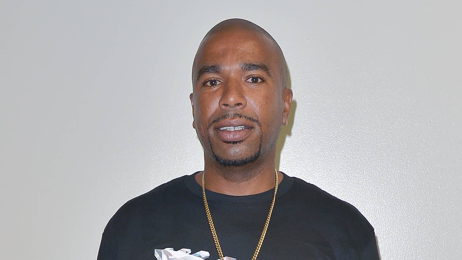 N.O.R.E. poses for photo at a book signing event.
