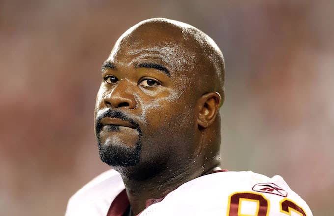 Albert Haynesworth stands on the sidelines during preseason NFL game against the Arizona Cardinals.