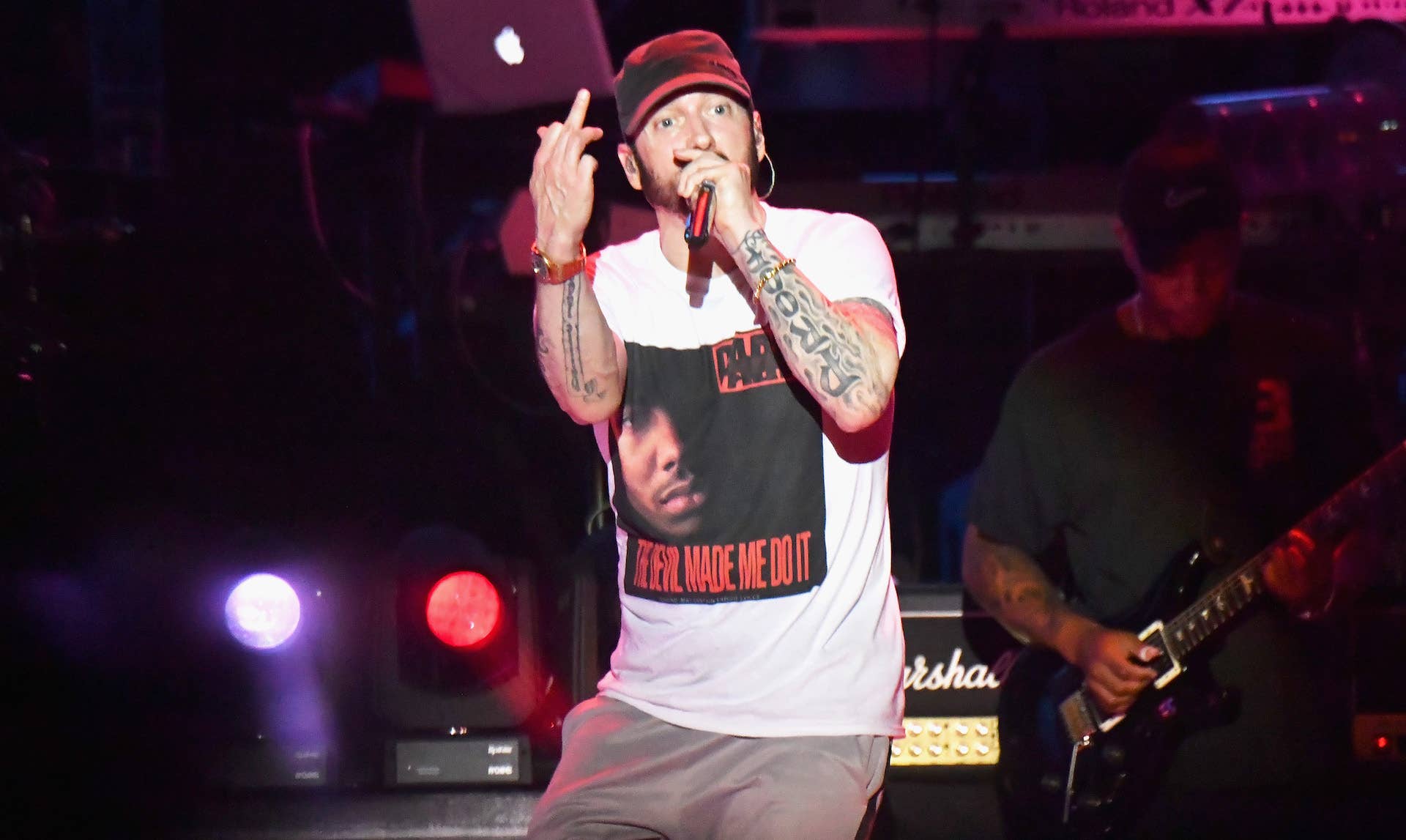 Eminem performing on stage in 2019