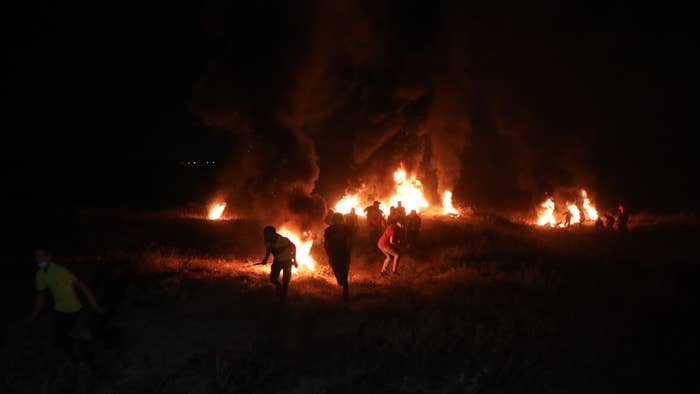 Demonstrators burn tires after the intervention of Israeli forces in Gaza City, Gaza.