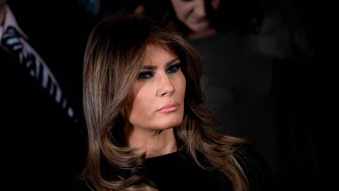 Melania Trump listens to the US president deliver remarks.