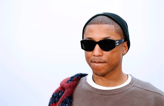 Pharrell Williams poses during the photocall before the Chanel women's fashion show