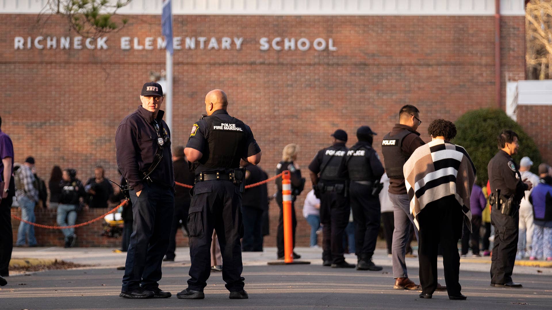 Police respond to a shooting that injured a teacher at Richneck Elementary in Newport News, Virginia
