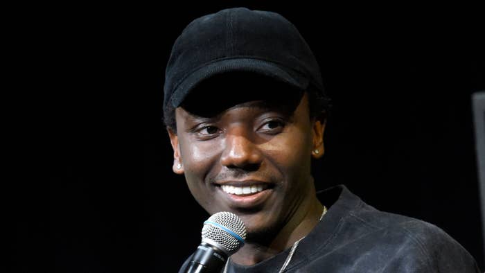 Jerrod Carmichael is seen holding a microphone