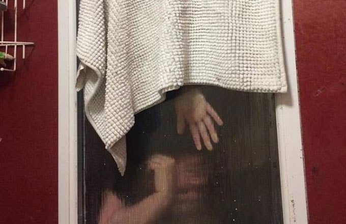 A woman gets stuck in a bathroom window after attempting to throw her poop out of it.