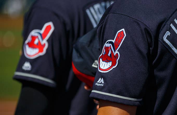 The Cleveland Indians stand for the National Anthem prior to a Spring Training game.