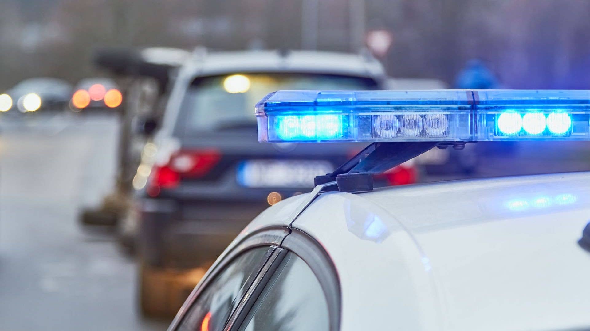 Police car blue lights on a car accident place stock photo