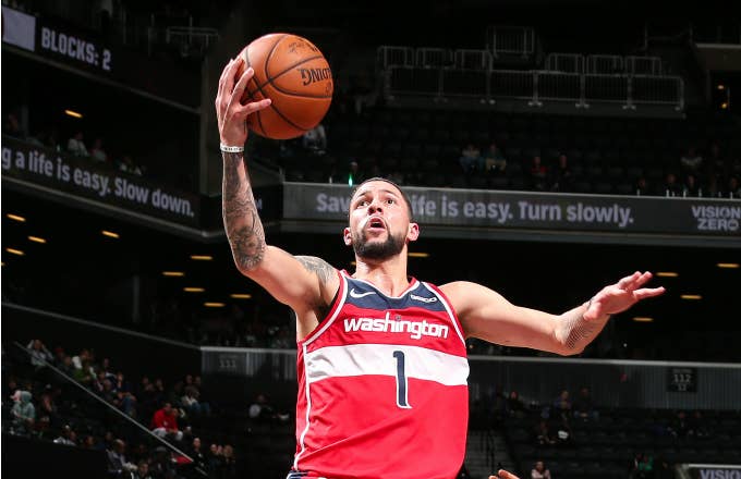 Austin Rivers of the Washington Wizards drives to the basket