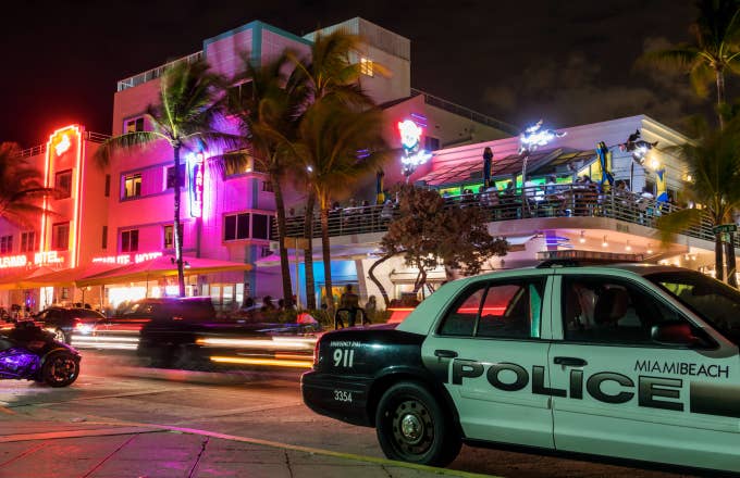 Florida, Miami Beach, Wet Willie's at night with Police Cruiser
