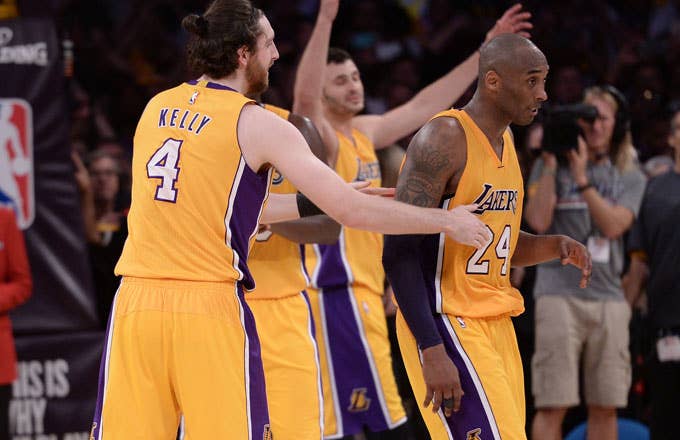 Kobe Bryant is celebrated by his teammates at the conclusion of his final game.