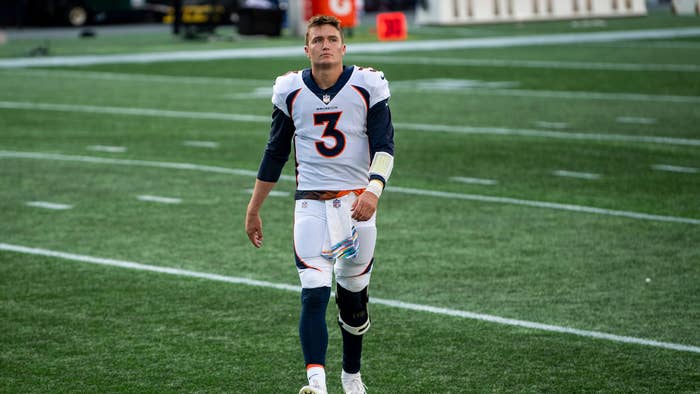 Drew Lock #3 of the Denver Broncos walks off the field