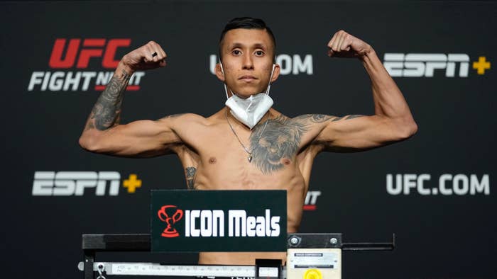 Jeff Molina poses on the scale during the UFC Fight Night