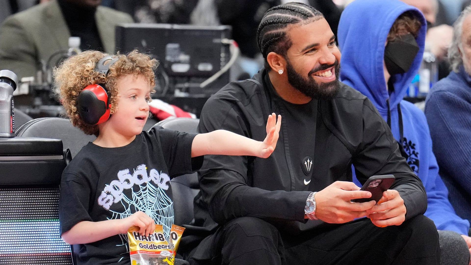 Drake and Adonis at a basketball game
