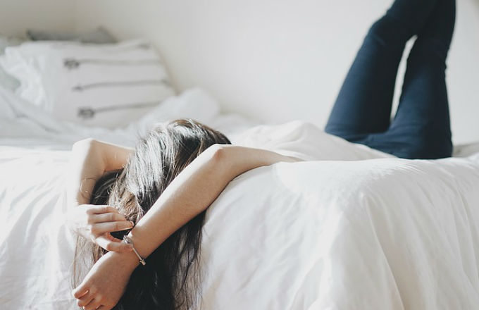 Woman lying in bed.