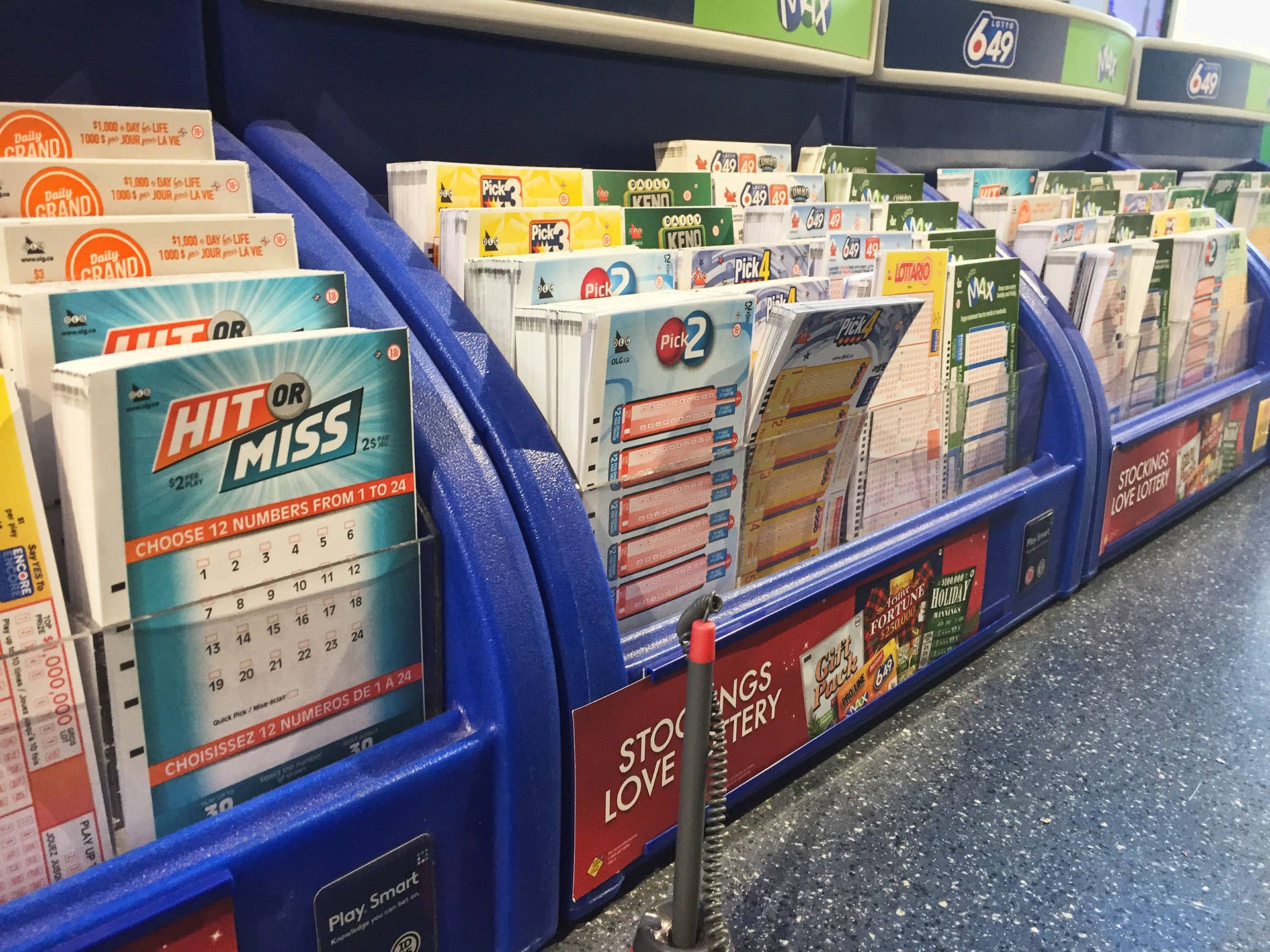Lottery number selection slips seen at a shop as the largest lottery jackpot in Canadian history