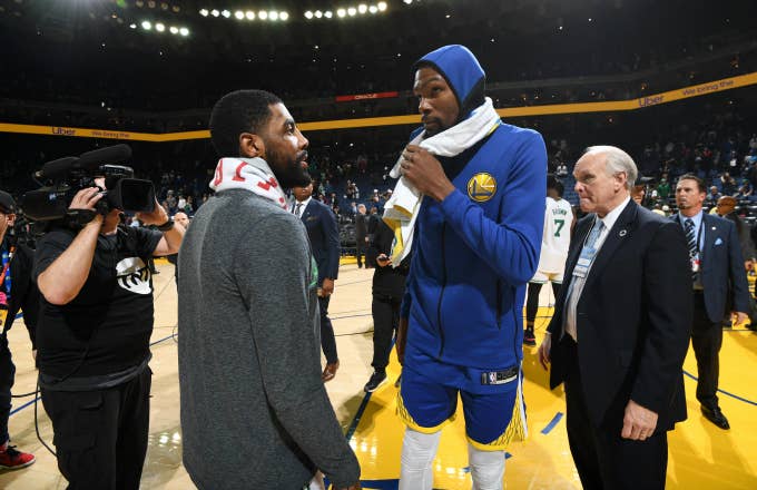 Kyrie Irving #11 of the Boston Celtics speaks with Kevin Durant #35 of the Golden State Warriors