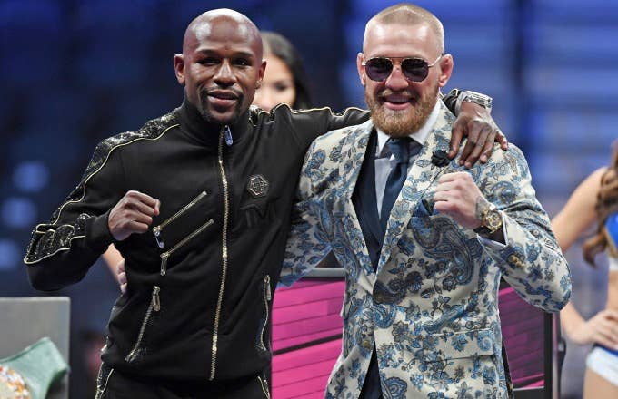 Floyd Mayweather and Conor McGregor pose after their big fight.