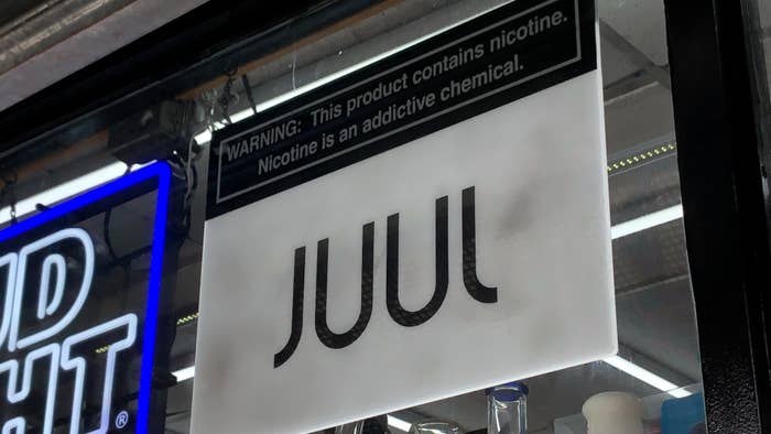 Juul logo is seen in window of store