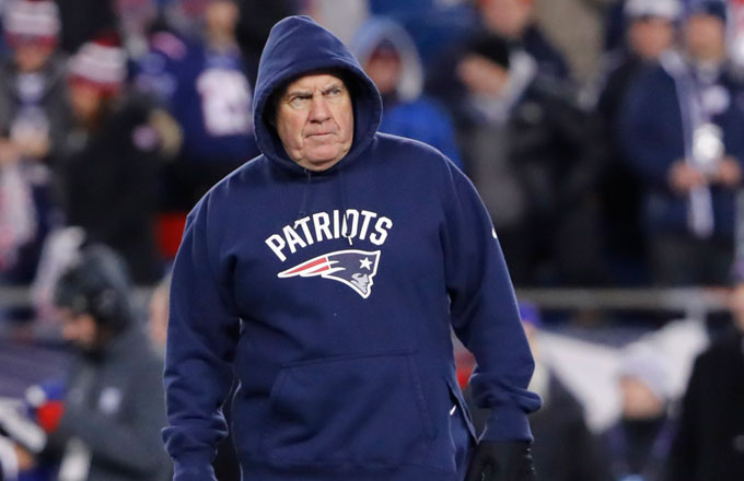 Bill Belichick lumbers around on the sideline during a playoff game against the Texans.